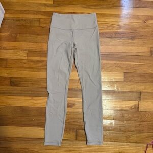 athleta light tan leggings with back logo